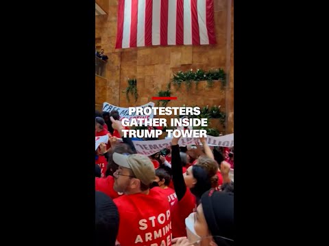 Protesters gather inside Trump Tower