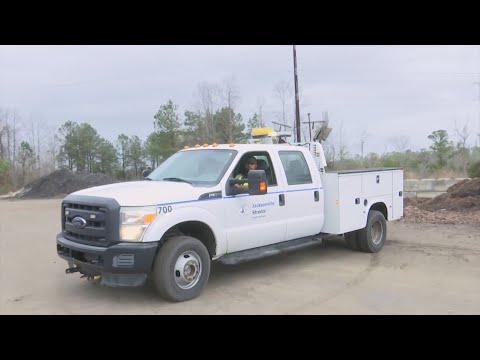 Jacksonville Streets Department employees working to clear debris after storm