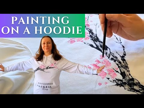 Painting with acrylic paint on a fabric of a hoodie for myself to wear