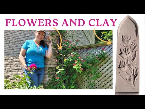 Low relief sculpture of flowers- making pottery in a blooming garden